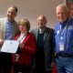 Kunal Mehra, President; Patricia Kelly, Vice President; Dr. Raman Mehra, CEO; and ESGR’s John Pelose getting an award