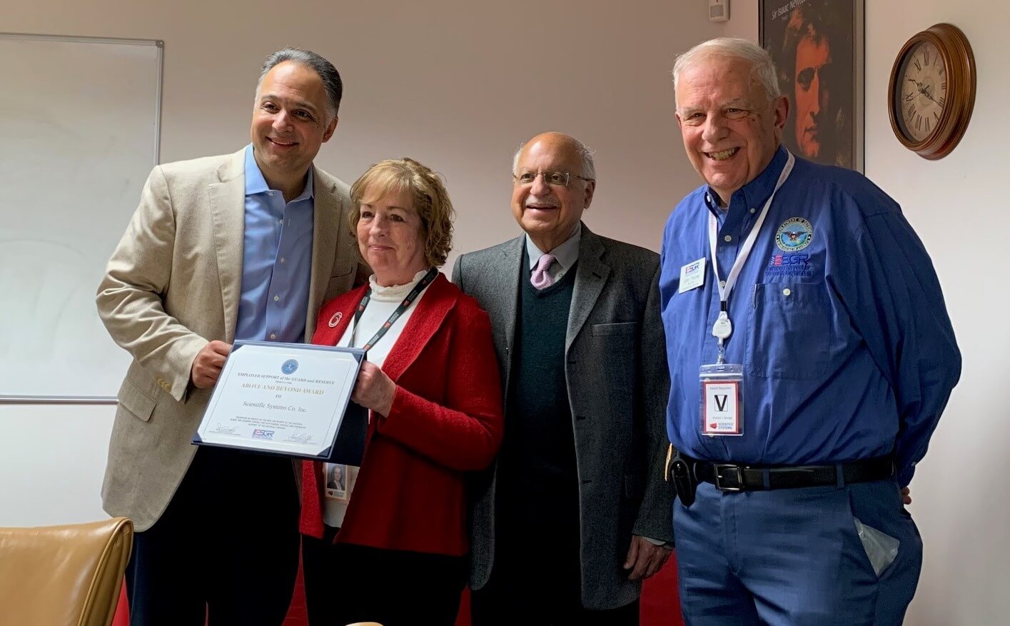 Kunal Mehra, President; Patricia Kelly, Vice President; Dr. Raman Mehra, CEO; and ESGR’s John Pelose getting an award